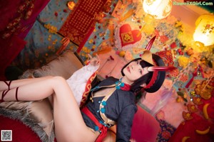 A woman dressed in a chinese costume posing for a picture.