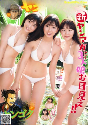 A group of three women in white bikinis standing in the water.