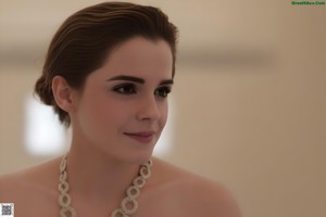 A nude woman sitting on a white chair.