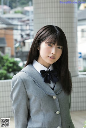A magazine with a picture of a woman in a school uniform.