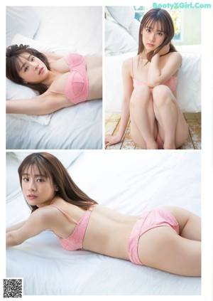 A woman in a pink bra and panties sitting on a bed.