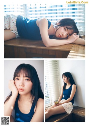A woman in a blue sweater is posing for a magazine.