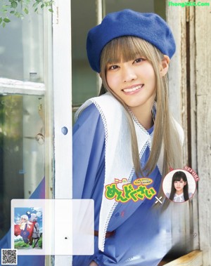 A woman in a blue hat is posing for a magazine.